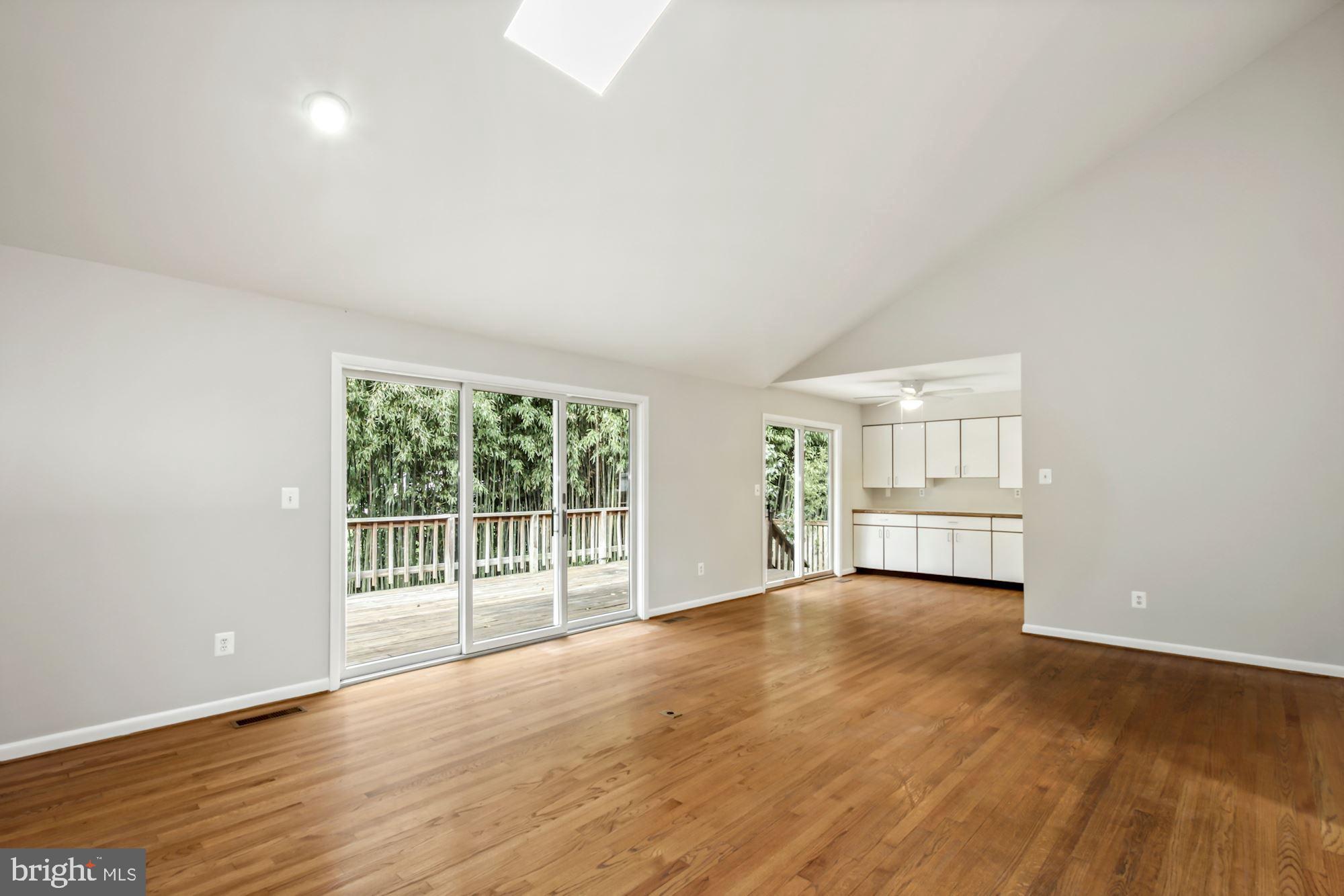 6203 Winston Drive Bethesda, MD 20817 - Photo 6 of 35 Hardwood floors with sliding glass door to deck