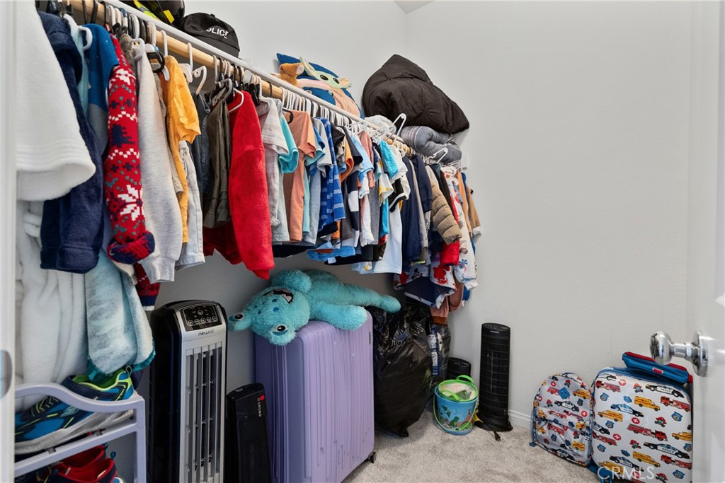 232 River Street Fillmore, CA 93015 - Photo 37 of 61 a view of walk in closet with clothes and shoes