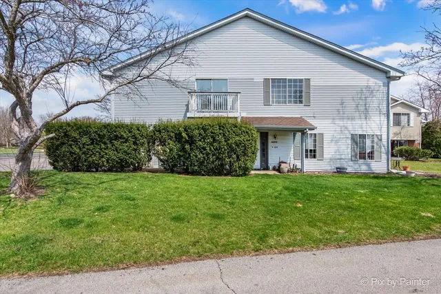 a view of a yard in front of a house