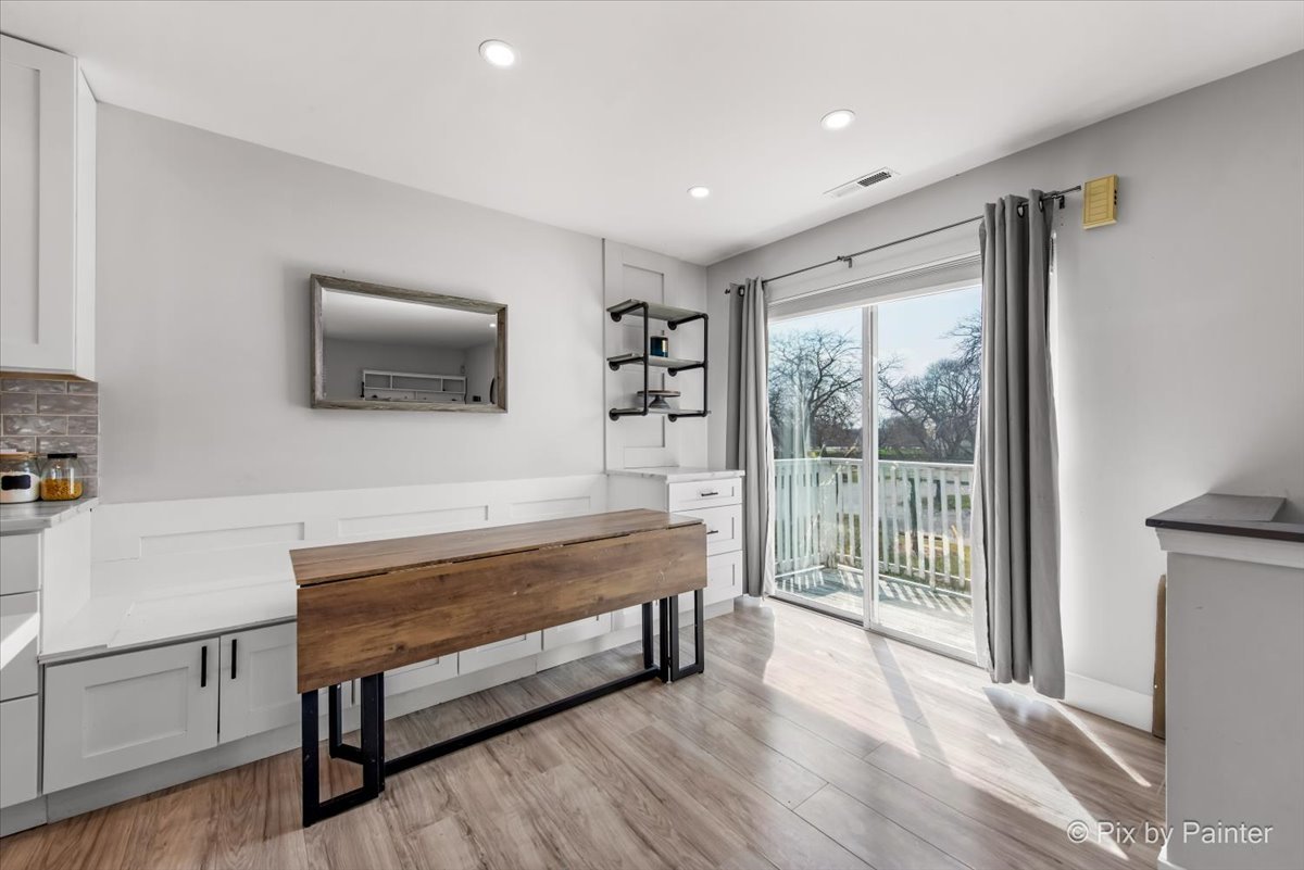 6-s018 Steeple Run Drive, Unit 6S018 Naperville, IL 60540 - Photo 11 of 22 a living room with furniture a flat screen tv and a floor to ceiling window
