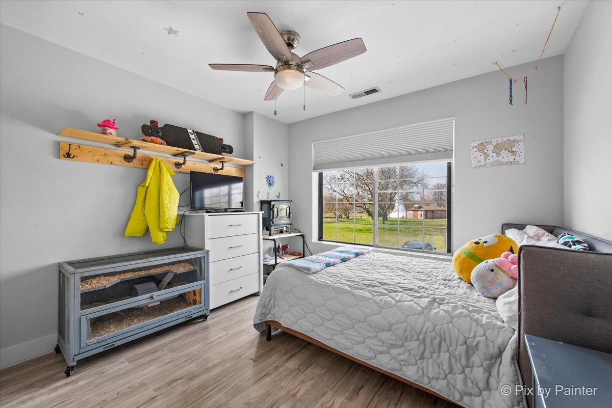 6-s018 Steeple Run Drive, Unit 6S018 Naperville, IL 60540 - Photo 12 of 22 a bedroom with a bed a window and dresser