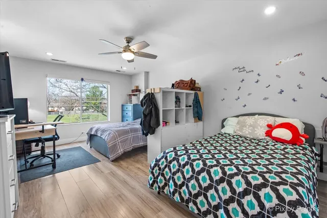 a bedroom with furniture and a window