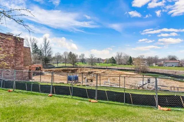 a view of a swimming pool with a lake view