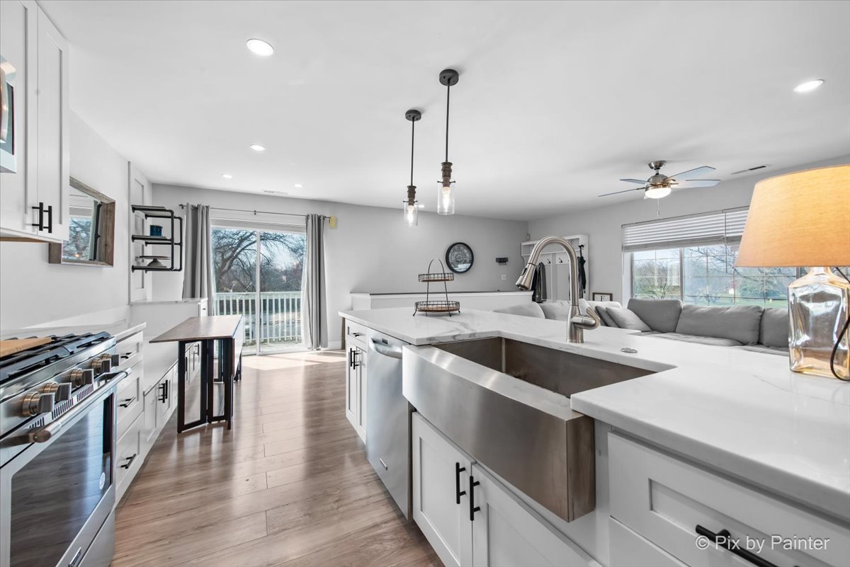 6-s018 Steeple Run Drive, Unit 6S018 Naperville, IL 60540 - Photo 10 of 22 a kitchen with sink stove and wooden floor