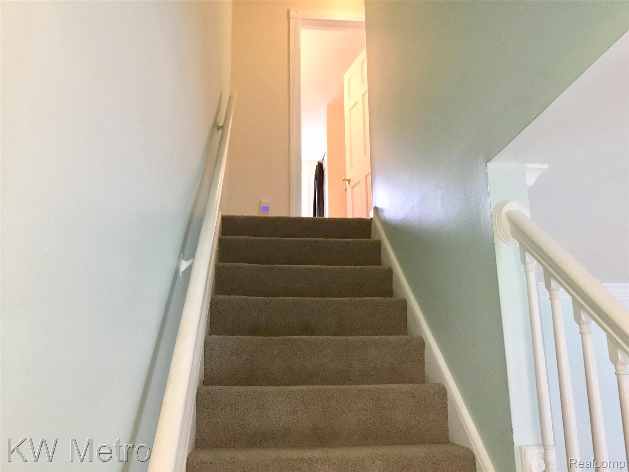 67976 Van Dyke Road, Unit 13 Washington, MI 48095 - Photo 13 of 23 Stairs Leading to Bedrooms
