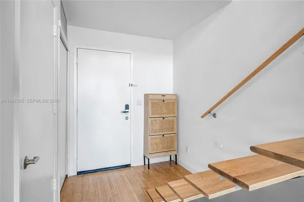 a view of front door and bedroom