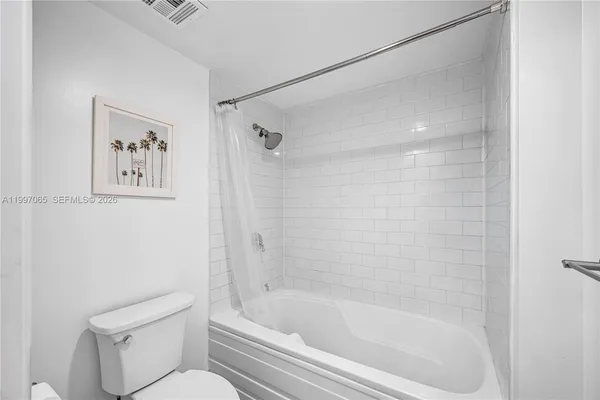 a swimming pool with outdoor seating and couches