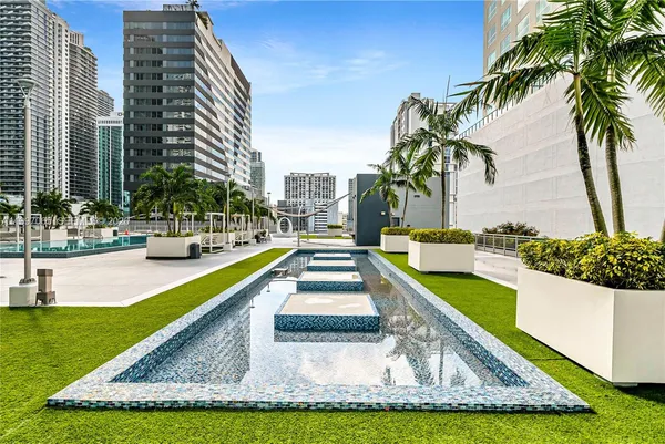 a view of a swimming pool with a patio