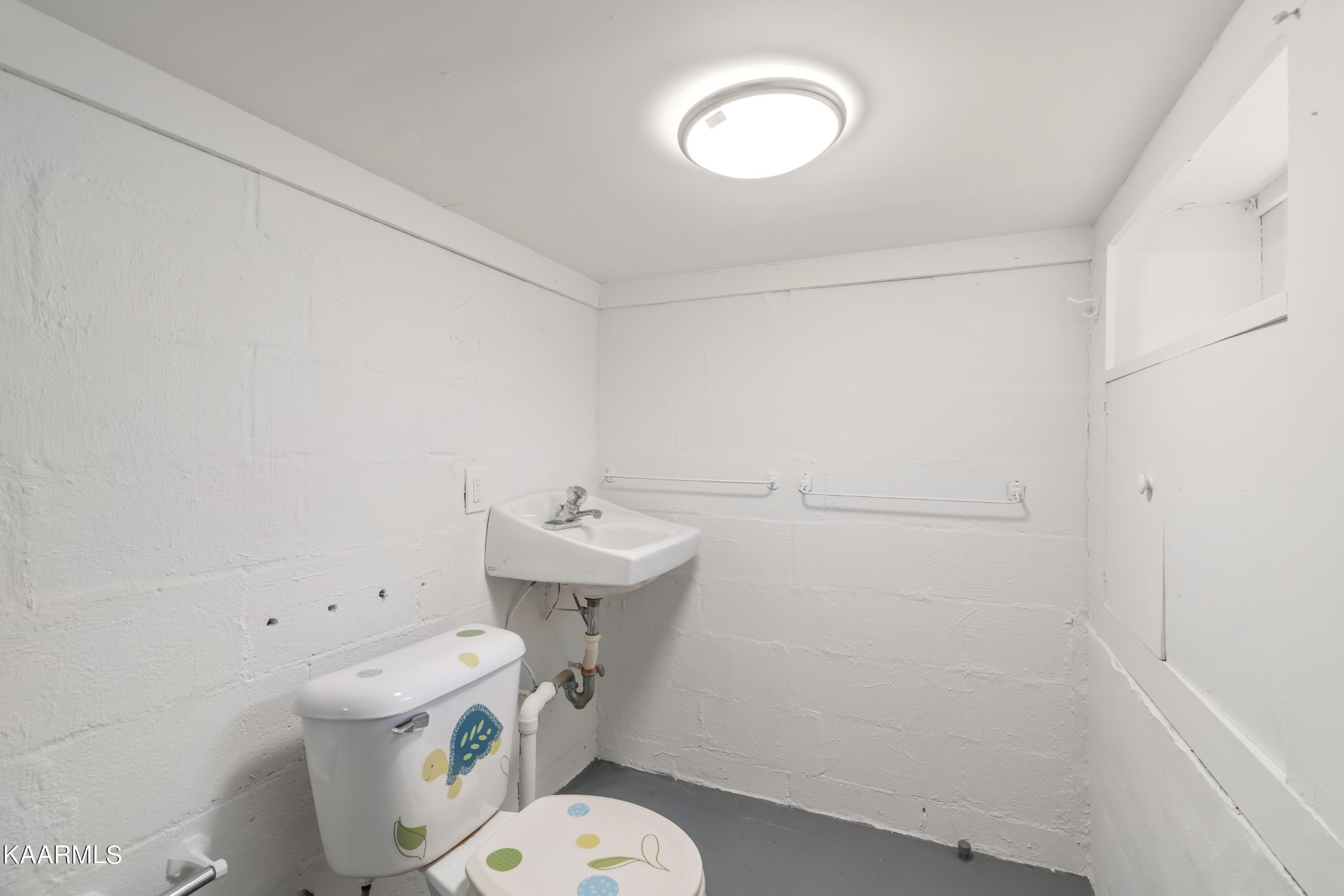 100 Rand Circle Oak Ridge, TN 37830 - Photo 33 of 36 a bathroom with a sink a toilet and a mirror