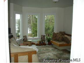 85 Rr 1 Springville, PA 18844 - Photo 6 of 6 a living room with furniture and a large window