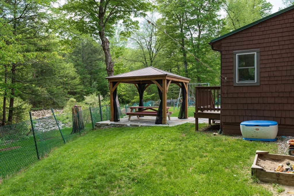 425 Dingle Road Worthington, MA 01098 - Photo 24 of 32 a view of a chair and table in backyard of the house