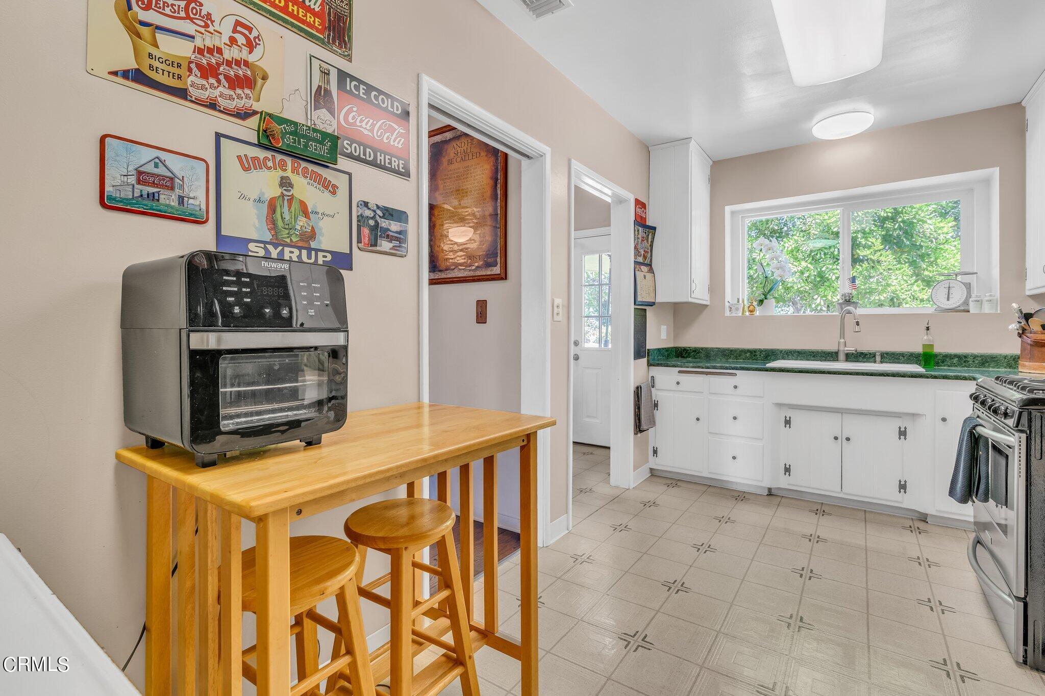 4632 Pennsylvania Avenue La Crescenta, CA 91214 - Photo 11 of 41 a kitchen with stainless steel appliances a stove a refrigerator and a window