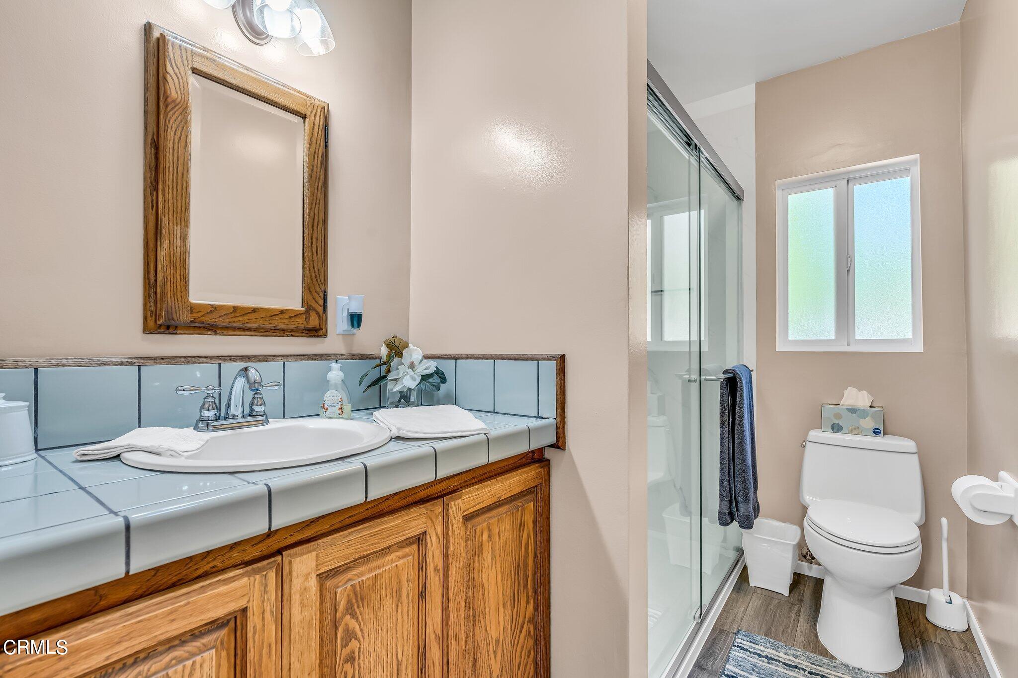 4632 Pennsylvania Avenue La Crescenta, CA 91214 - Photo 17 of 41 a bathroom with a sink and a mirror