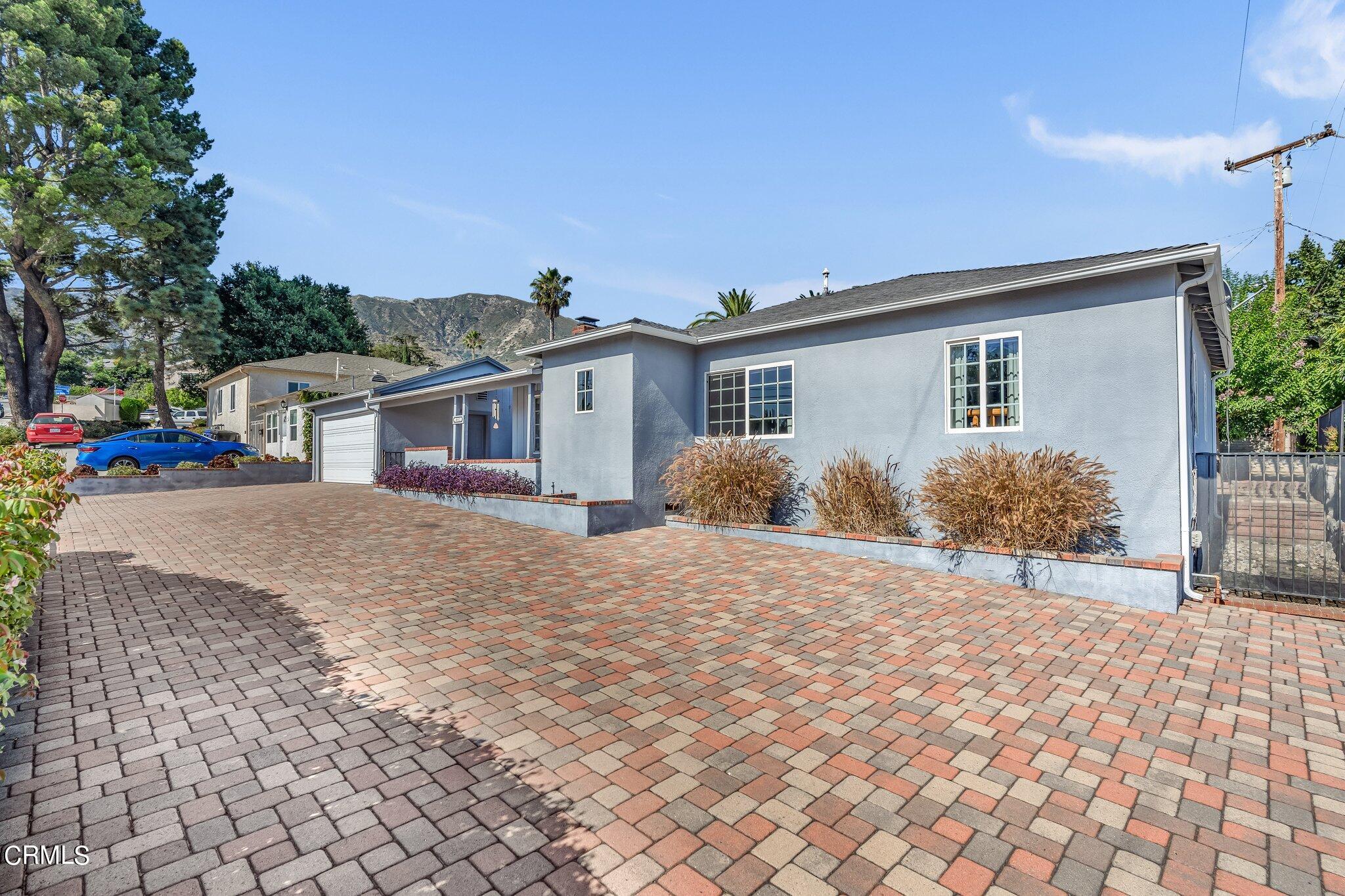 4632 Pennsylvania Avenue La Crescenta, CA 91214 - Photo 23 of 41 a front view of a house with a yard and garage