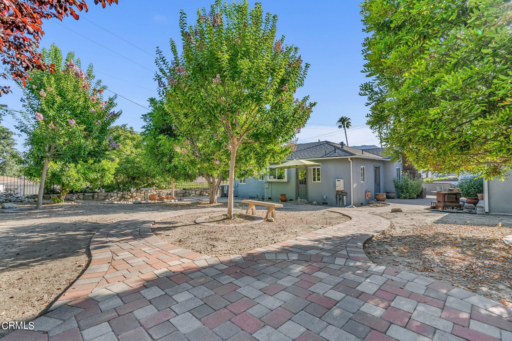 4632 Pennsylvania Avenue La Crescenta, CA 91214 - Photo 27 of 41 a patio with a table and chairs under an umbrella