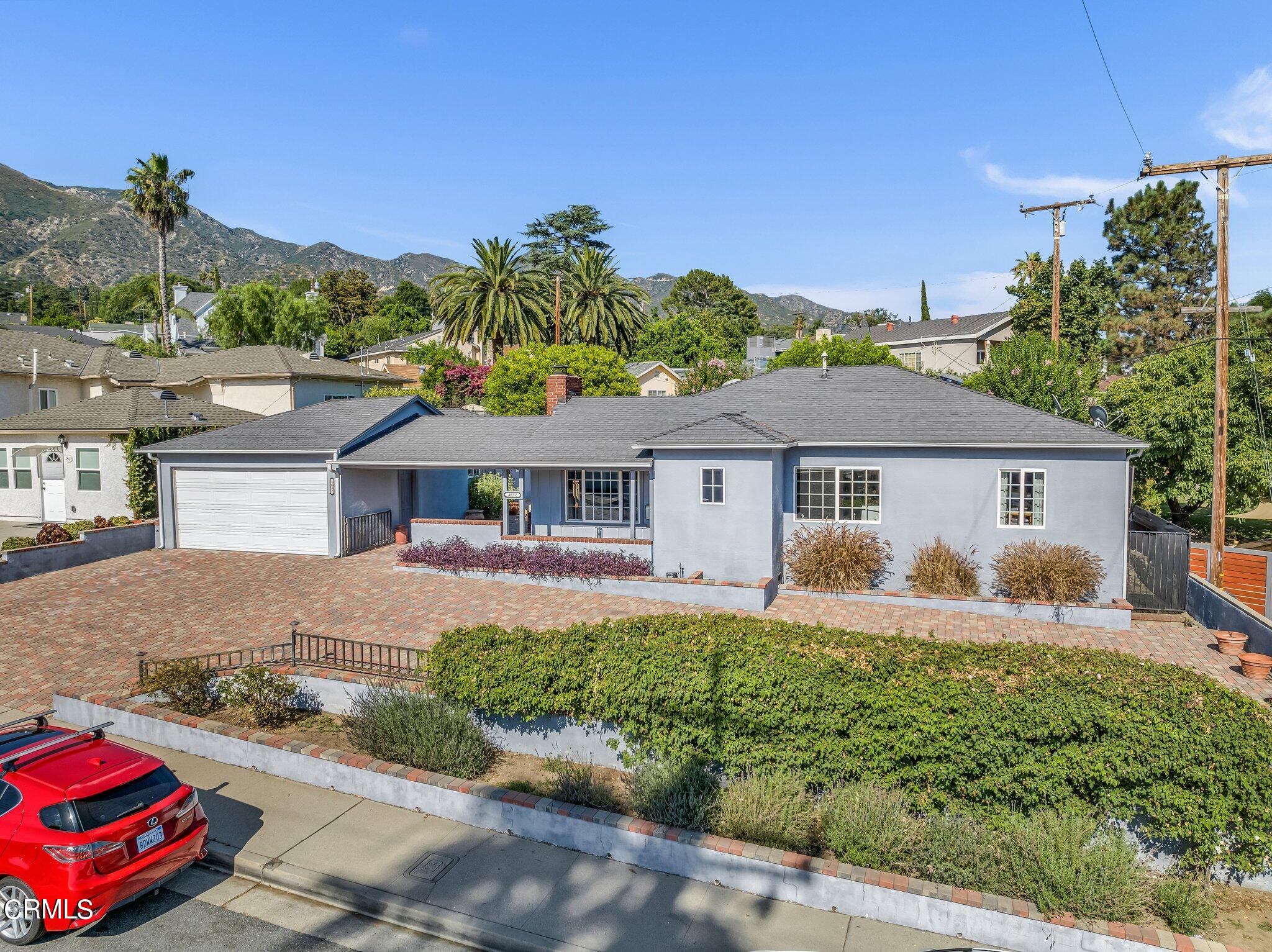 4632 Pennsylvania Avenue La Crescenta, CA 91214 - Photo 37 of 41 a front view of a house with a yard and garage