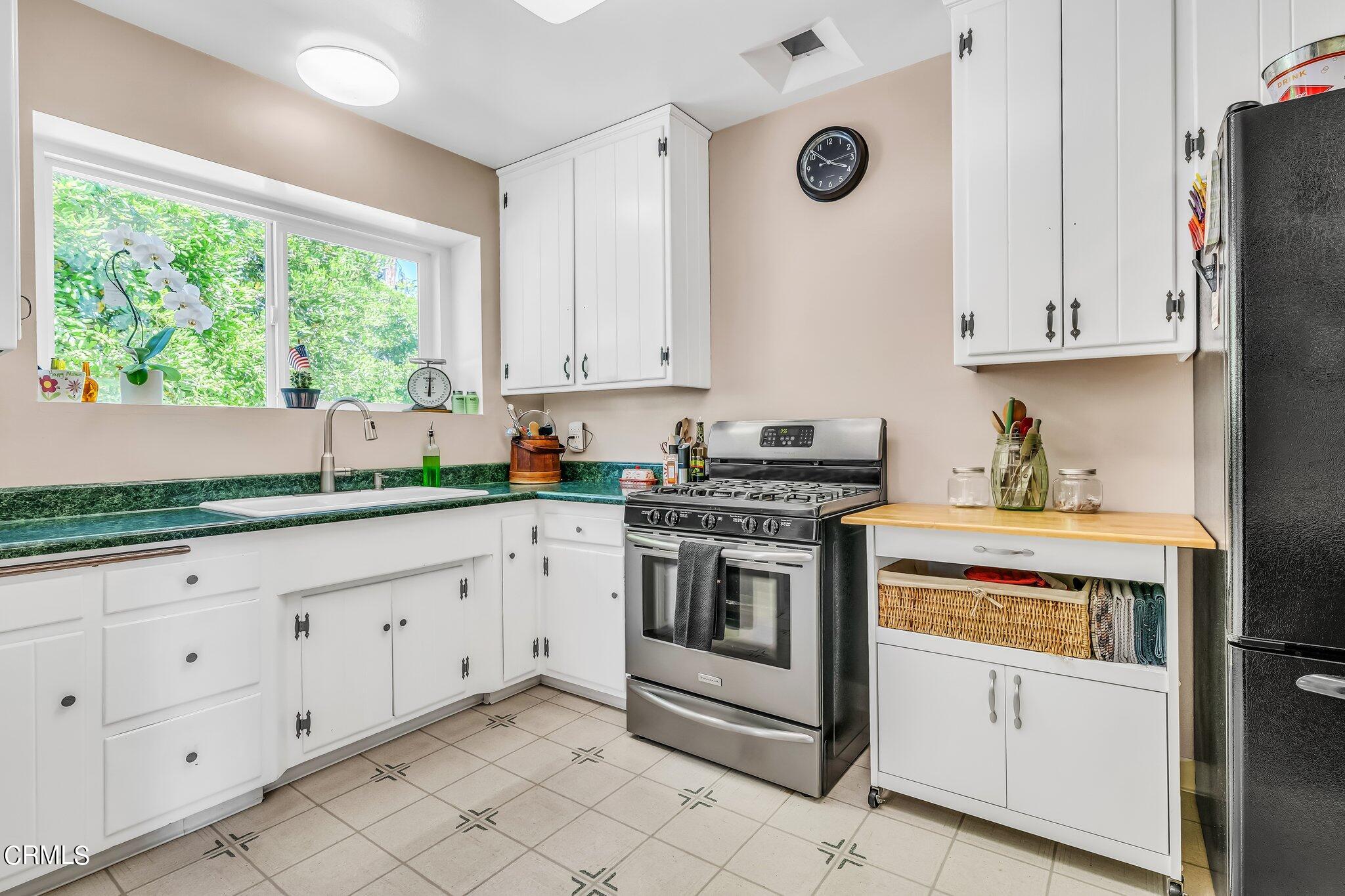 4632 Pennsylvania Avenue La Crescenta, CA 91214 - Photo 10 of 41 a kitchen with granite countertop white cabinets and white appliances