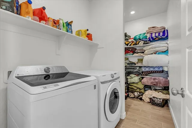 a spacious bedroom with a bed and a dresser