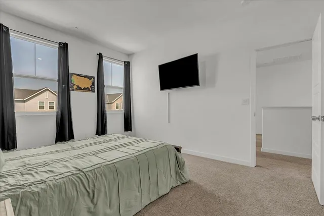 a room with furniture and a flat screen tv