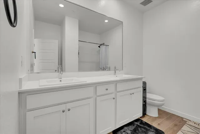 a bed room with a bed and a television