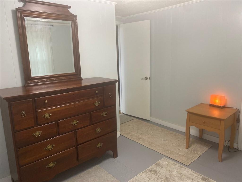 1525 Sloppy Floyd Lake Road Summerville, GA 30747 - Photo 7 of 17 a room with a mirror and cabinets