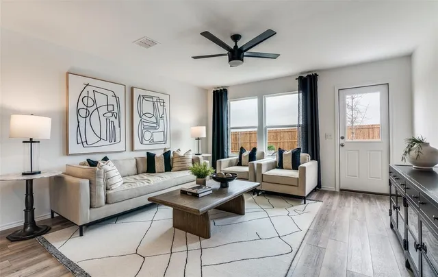 a living room with furniture and a window