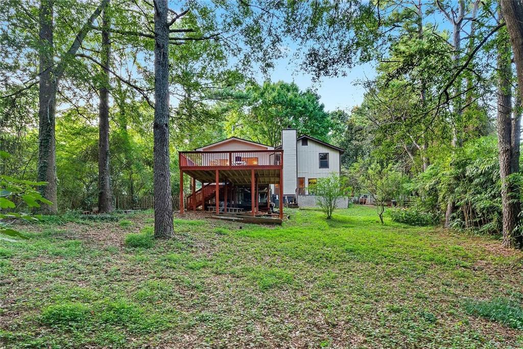 9825 Coleman Road Roswell, GA 30075 - Photo 17 of 17 a view of a house with backyard