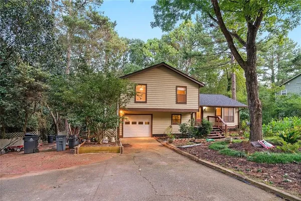 a front view of a house with garden