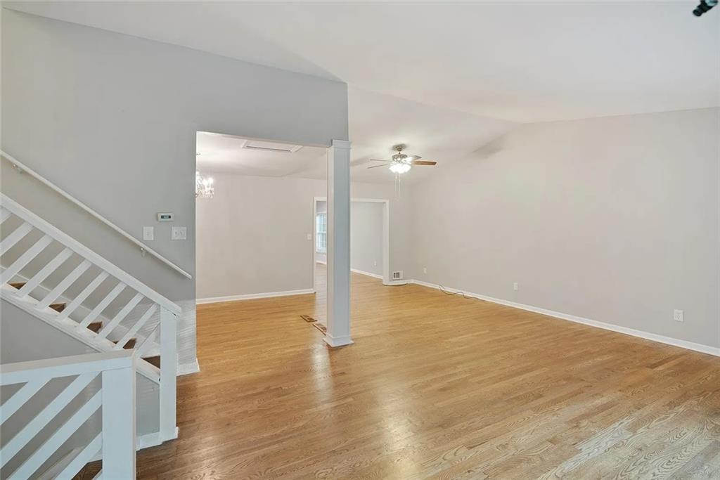9825 Coleman Road Roswell, GA 30075 - Photo 6 of 17 a view of an empty room with wooden floor