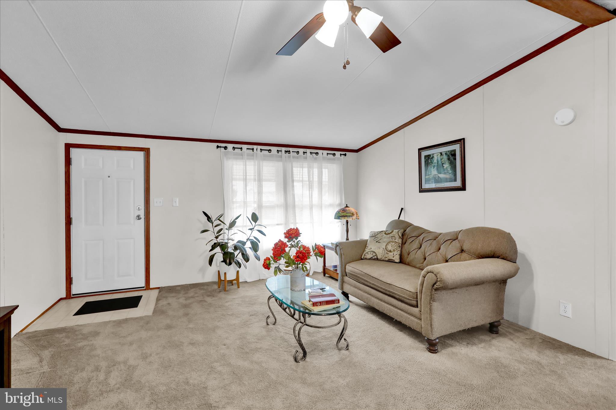 8758 Turkey Ridge Road Breinigsville, PA 18031 - Photo 13 of 29 a living room with furniture and a flat screen tv