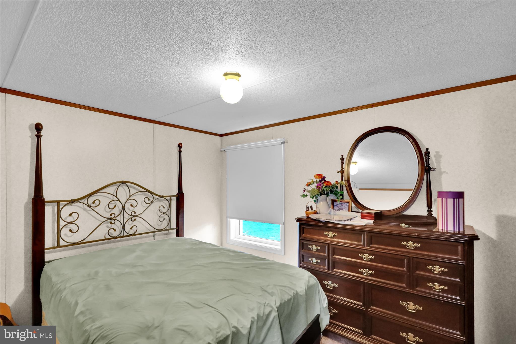 8758 Turkey Ridge Road Breinigsville, PA 18031 - Photo 23 of 29 a bedroom with a bed and a dresser