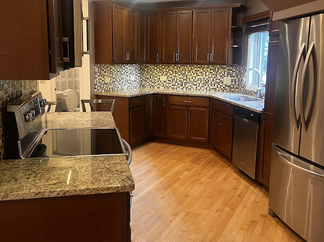 414 South Dee Road Park Ridge, IL 60068 - Photo 3 of 37 a kitchen with stainless steel appliances granite countertop a sink stove and refrigerator