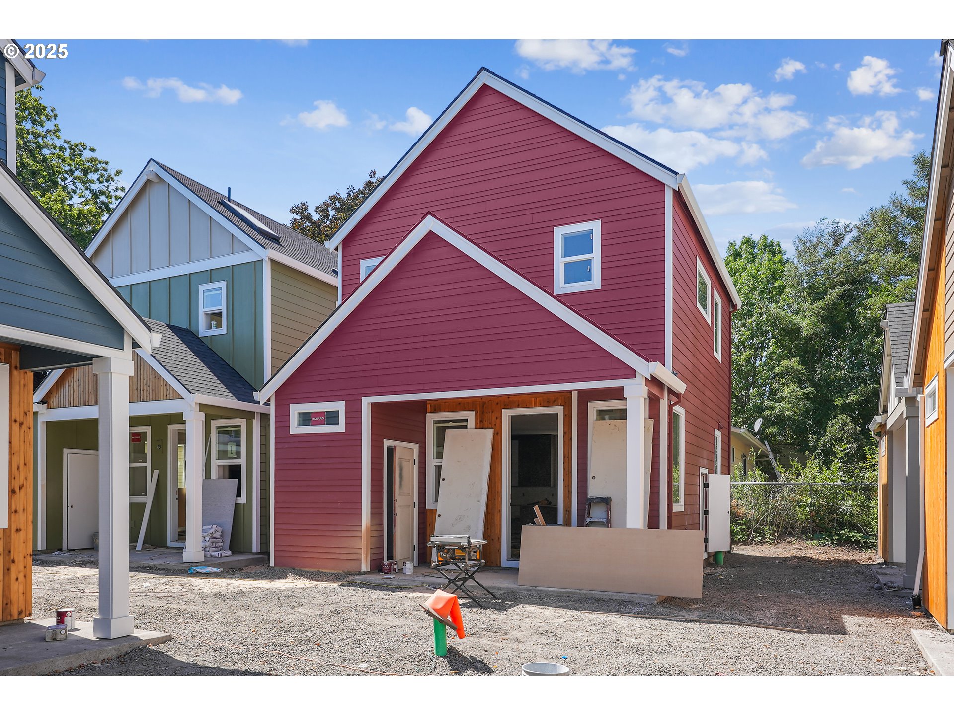 9556 Southwest 91st Avenue, Unit 2 Portland, OR 97223 - Photo 1 of 25 a front view of a house with a yard