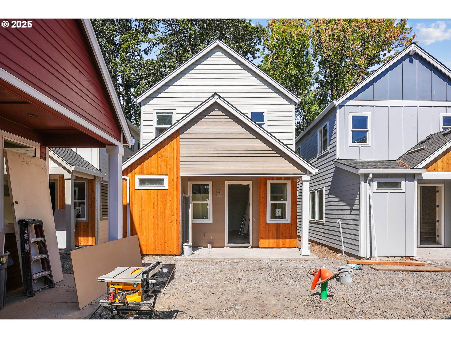 9556 Southwest 91st Avenue, Unit 2 Portland, OR 97223 - Photo 3 of 25 a backyard of a house with seating space