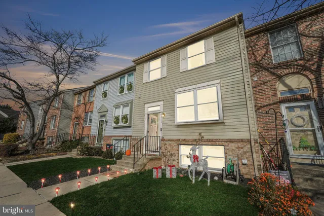 a view of a house with a yard porch and furniture