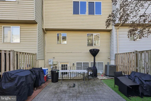 a view of a house with a bed and a lounge chair