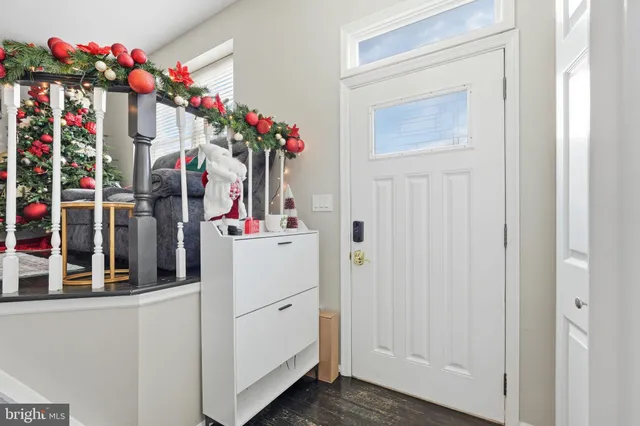 a view of living room with entryway and flowers