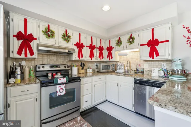 a kitchen with lots of appliances and cabinets