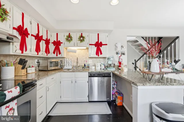 a kitchen with lots of white appliances