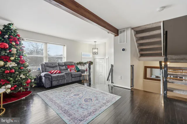 a living room filled with furniture window and wooden floor