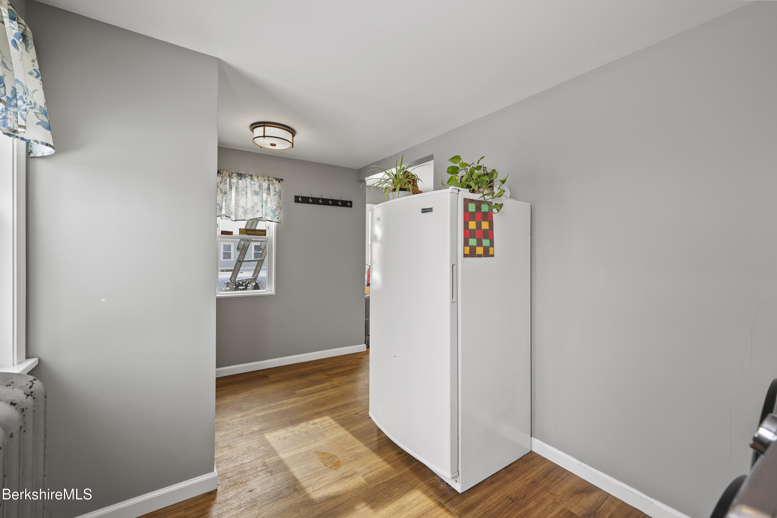 40 Stearns Avenue Pittsfield, MA 01201 - Photo 14 of 25 a utility room with refrigerator and hallway