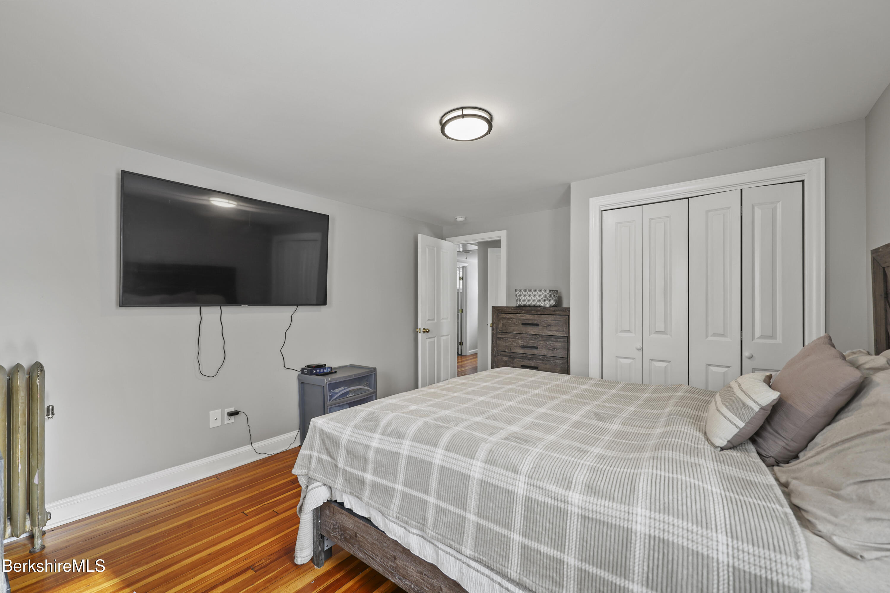 40 Stearns Avenue Pittsfield, MA 01201 - Photo 17 of 25 a bedroom with a bed tv and a window