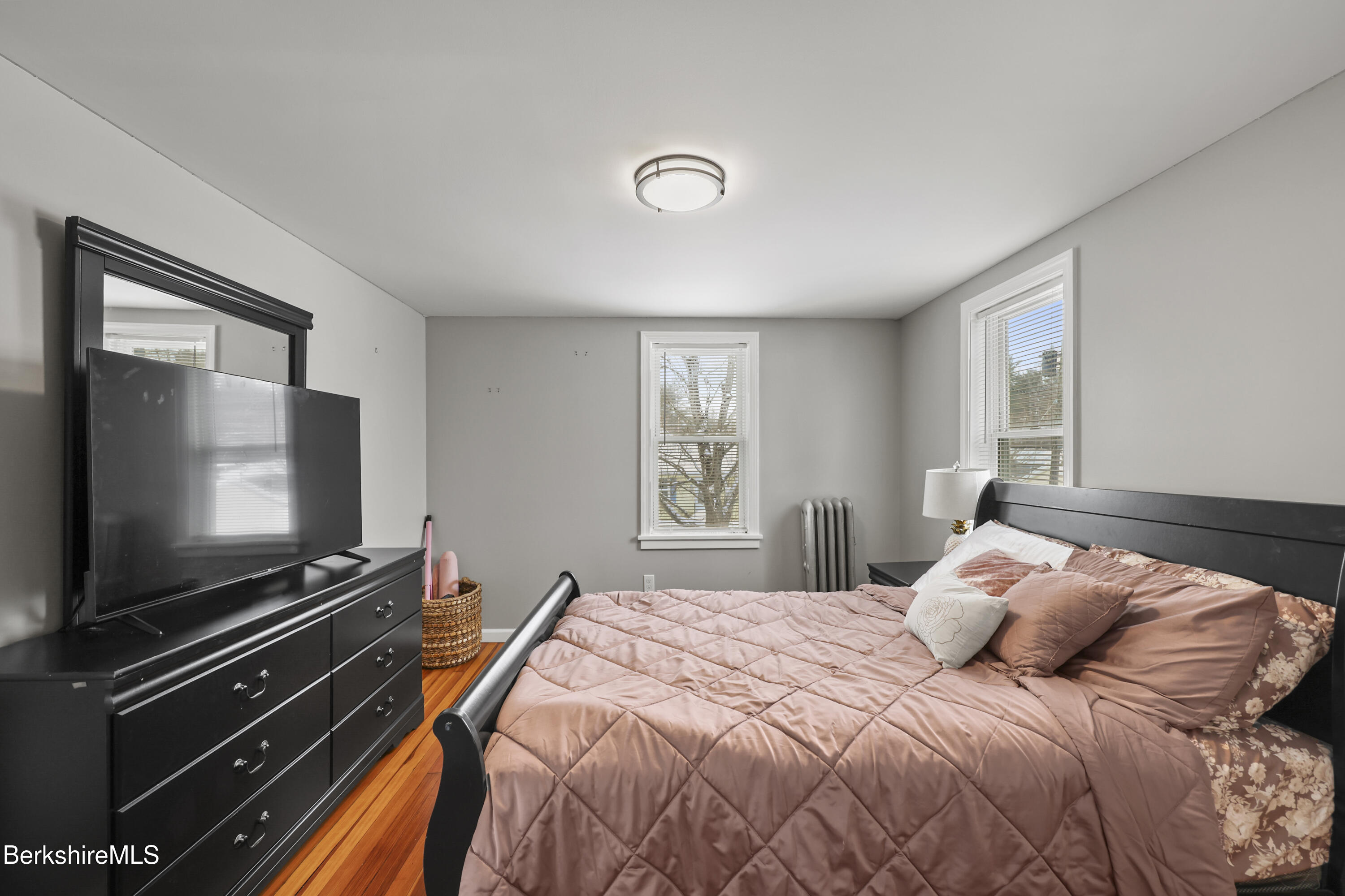 40 Stearns Avenue Pittsfield, MA 01201 - Photo 18 of 25 a bedroom with a bed and a flat screen tv