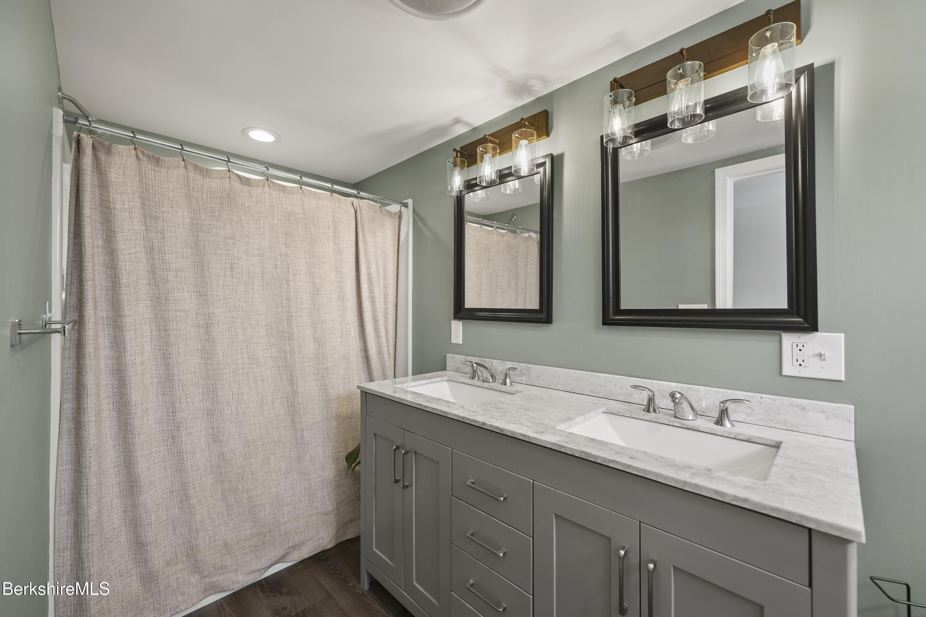 40 Stearns Avenue Pittsfield, MA 01201 - Photo 22 of 25 a bathroom with a double vanity sink and mirror