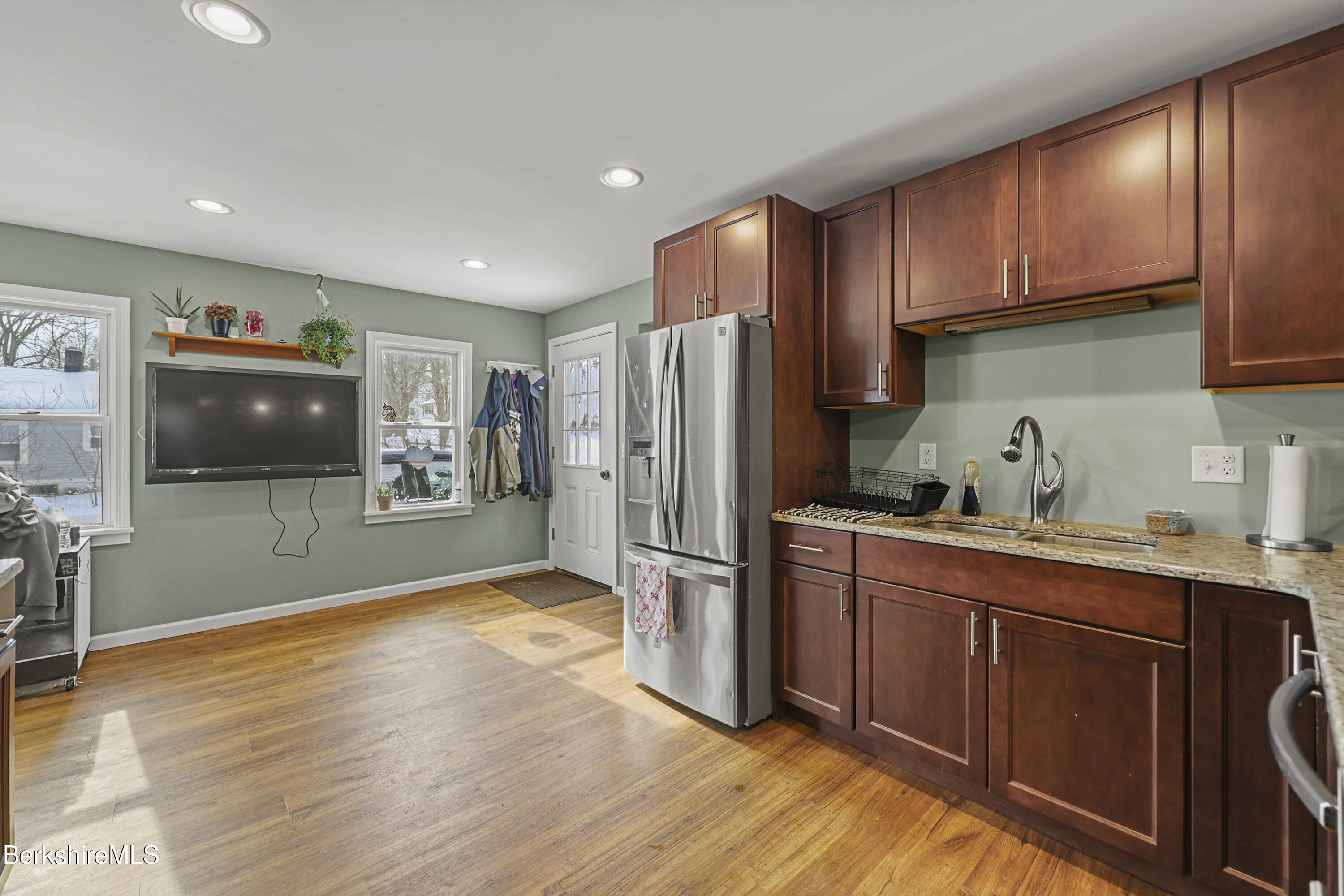 40 Stearns Avenue Pittsfield, MA 01201 - Photo 6 of 25 a kitchen with stainless steel appliances granite countertop a refrigerator stove top oven and sink