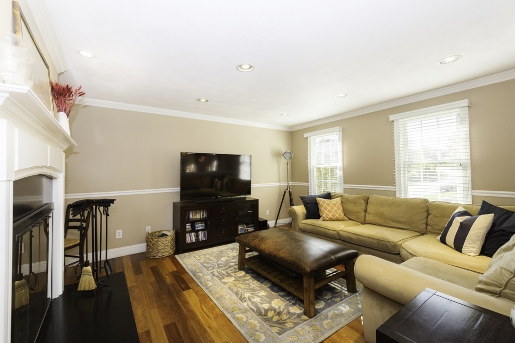 18 Paige Farm Road Amesbury, MA 01913 - Photo 13 of 28 a living room with furniture and a flat screen tv