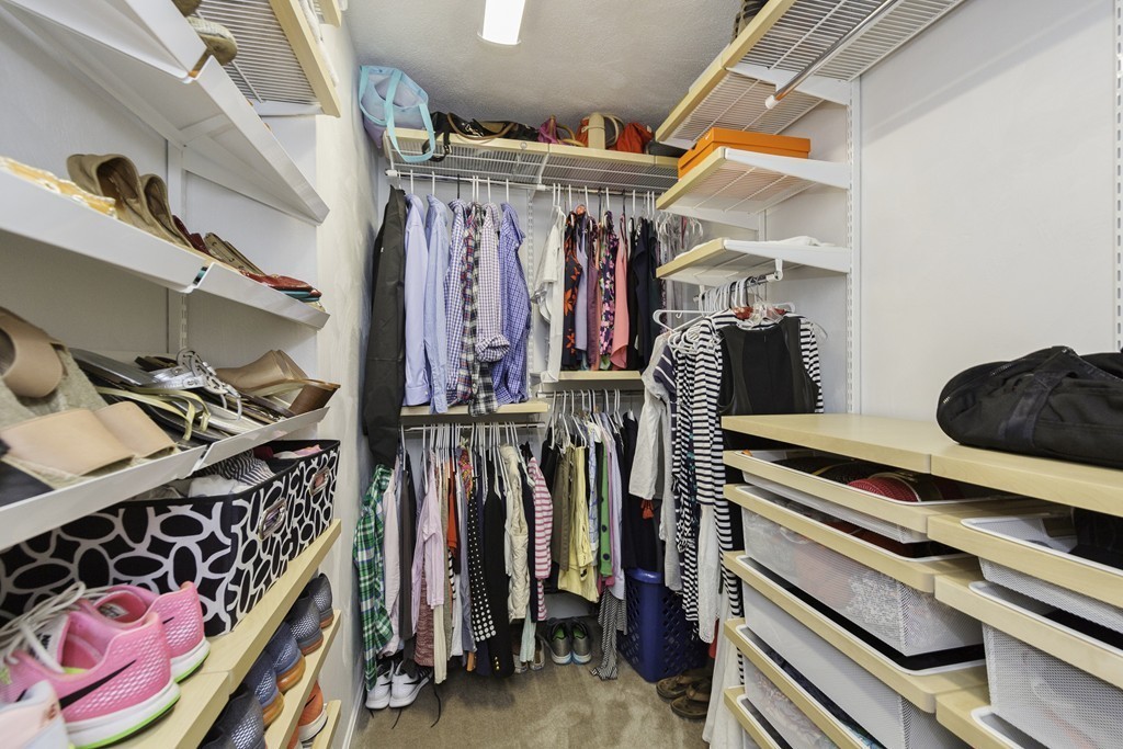 18 Paige Farm Road Amesbury, MA 01913 - Photo 17 of 28 a view of walk in closet with clothes and shoes
