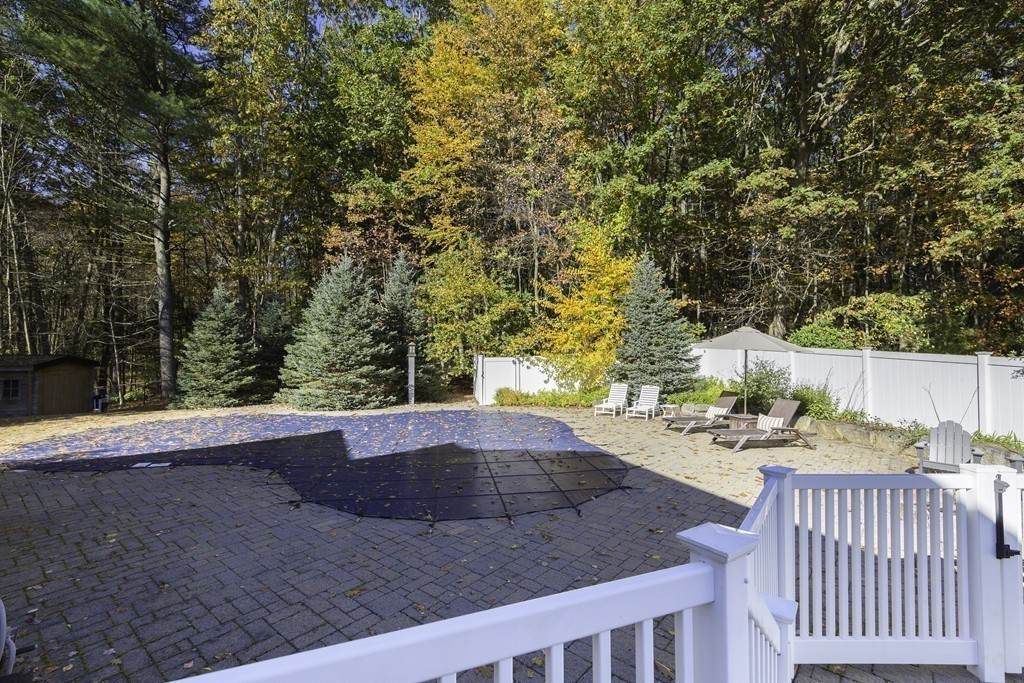 18 Paige Farm Road Amesbury, MA 01913 - Photo 26 of 28 a view of a backyard with table and chairs