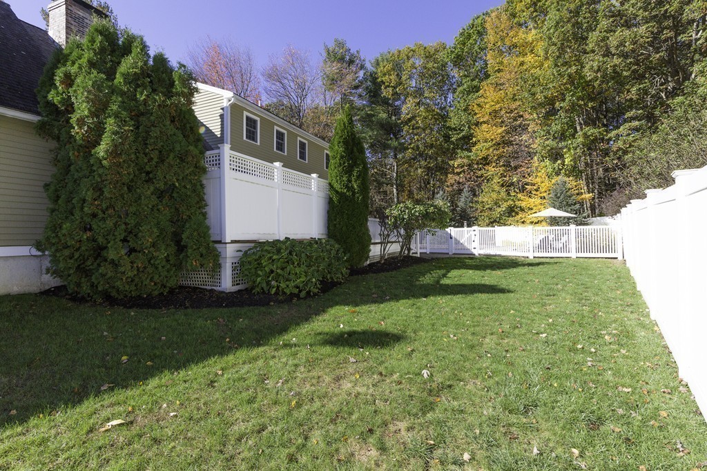 18 Paige Farm Road Amesbury, MA 01913 - Photo 27 of 28 a view of a backyard with a garden
