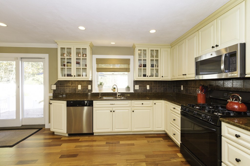 18 Paige Farm Road Amesbury, MA 01913 - Photo 8 of 28 a kitchen with stainless steel appliances granite countertop a stove and a sink